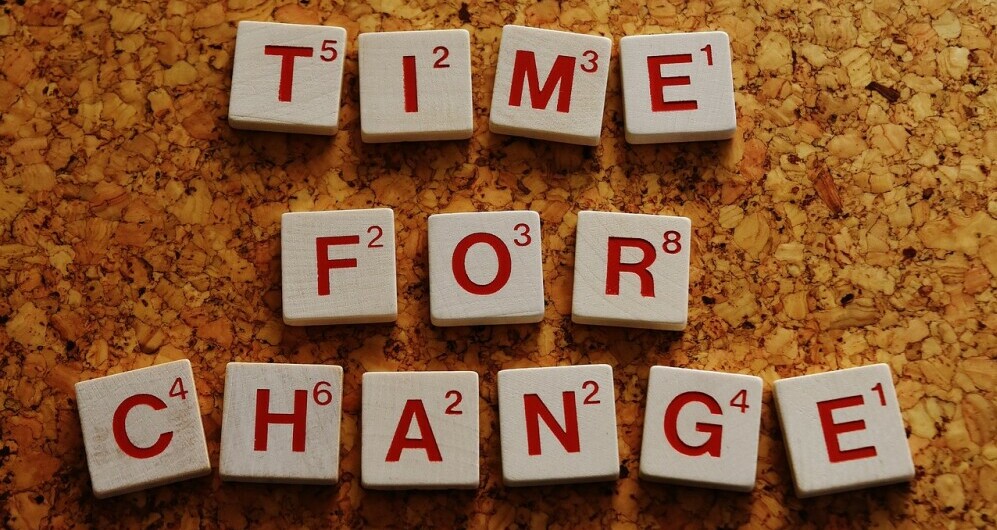 Scrabble pieces spelling "Time For Change"